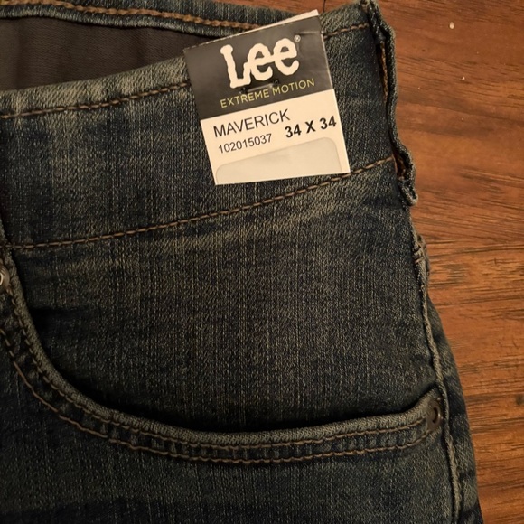 NWT MEN'S EXTREME MOTION TAPERED LEG JEAN SIZE 34x34 - Picture 4 of 9